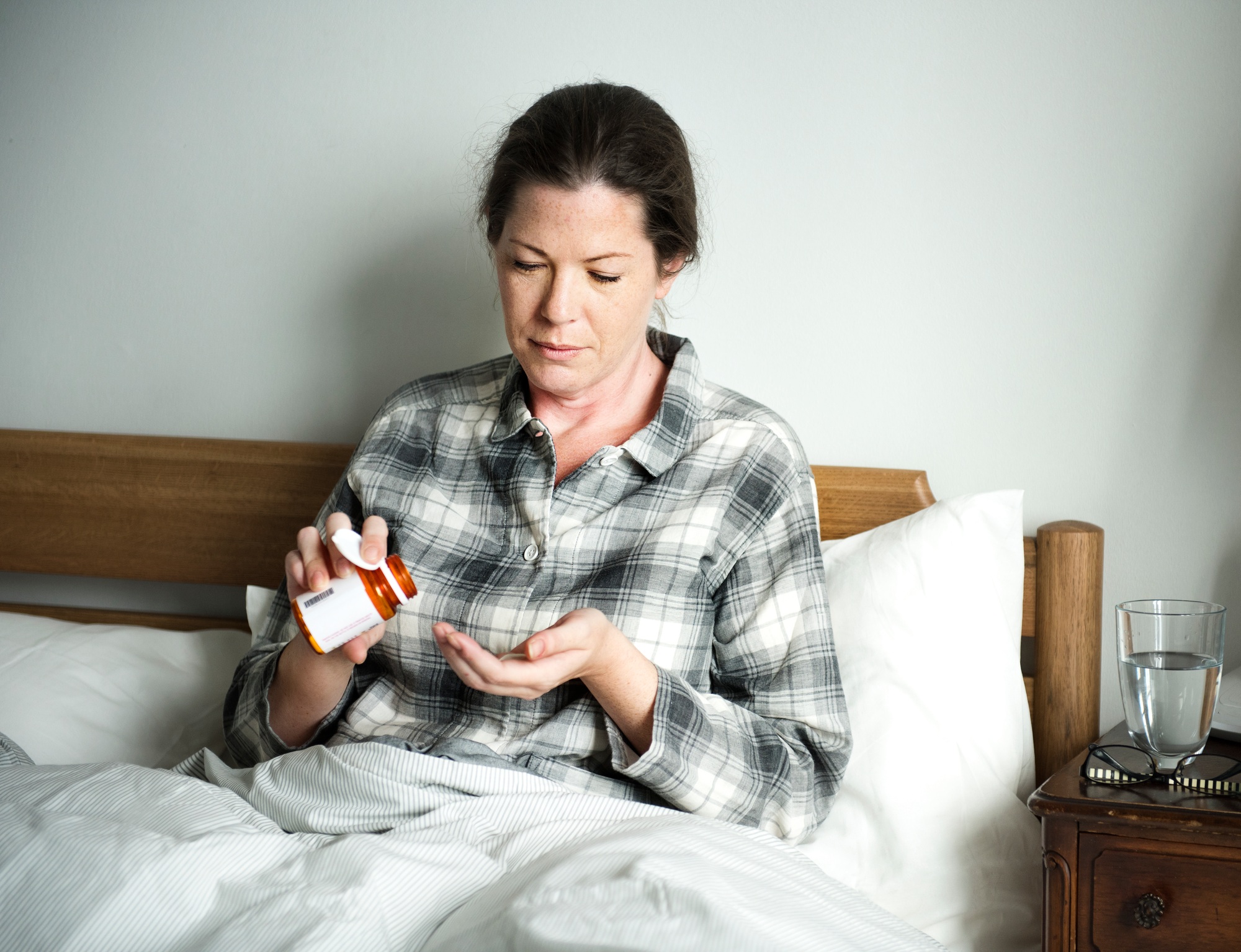 A woman taking medicine